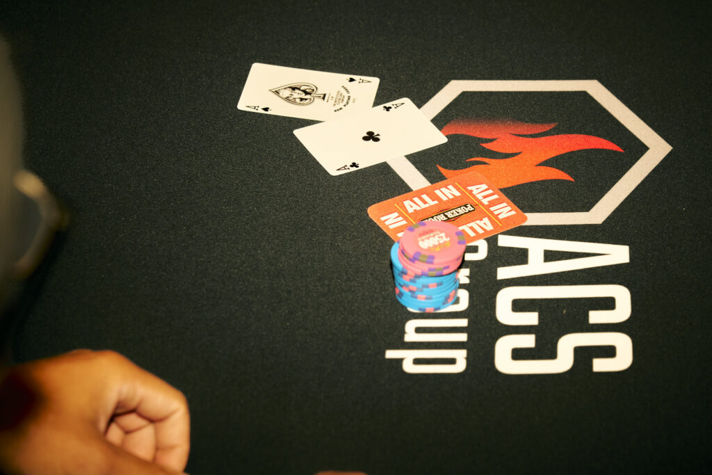 ACS Group logo on poker table at PTR charity event.